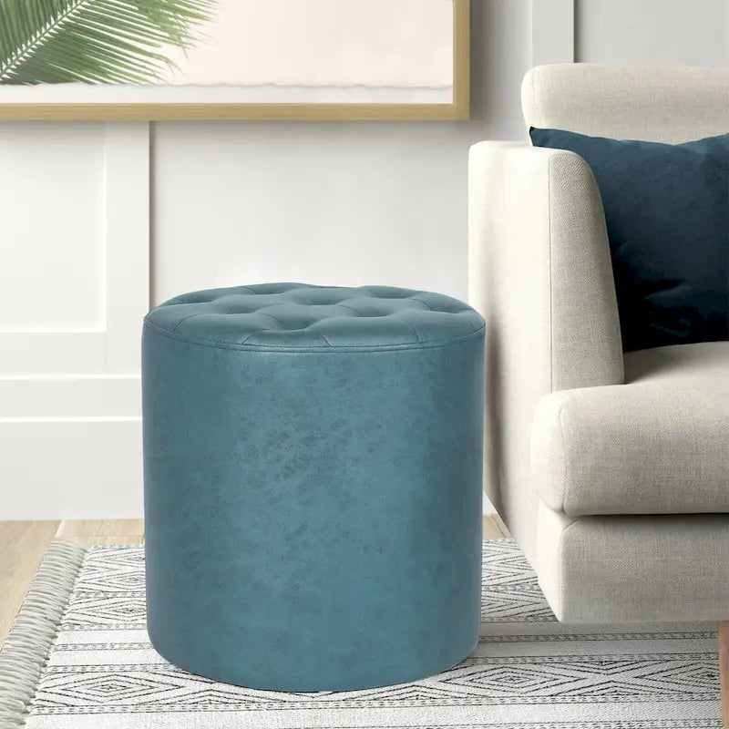Pouffe rond tapissé en simili cuir capitonné