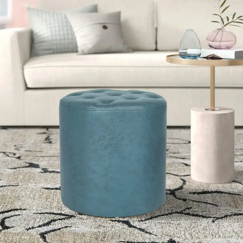 Pouffe rond tapissé en simili cuir capitonné