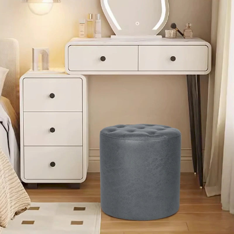 Pouffe rond tapissé en simili cuir capitonné