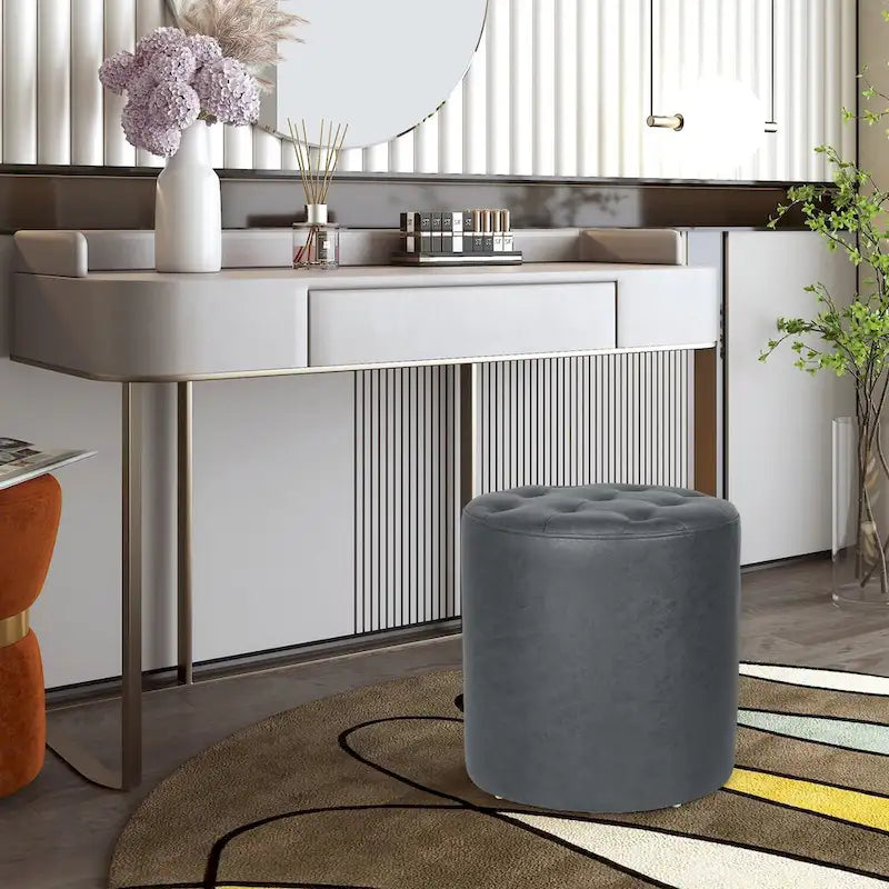 Pouffe rond tapissé en simili cuir capitonné