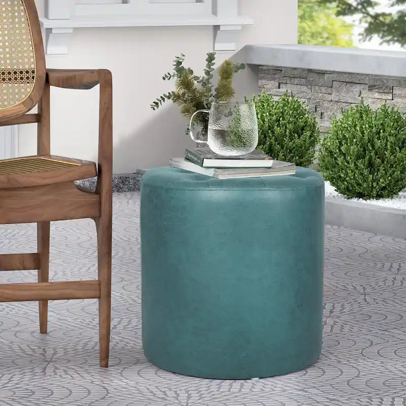 Pouffe rond tapissé en simili cuir capitonné